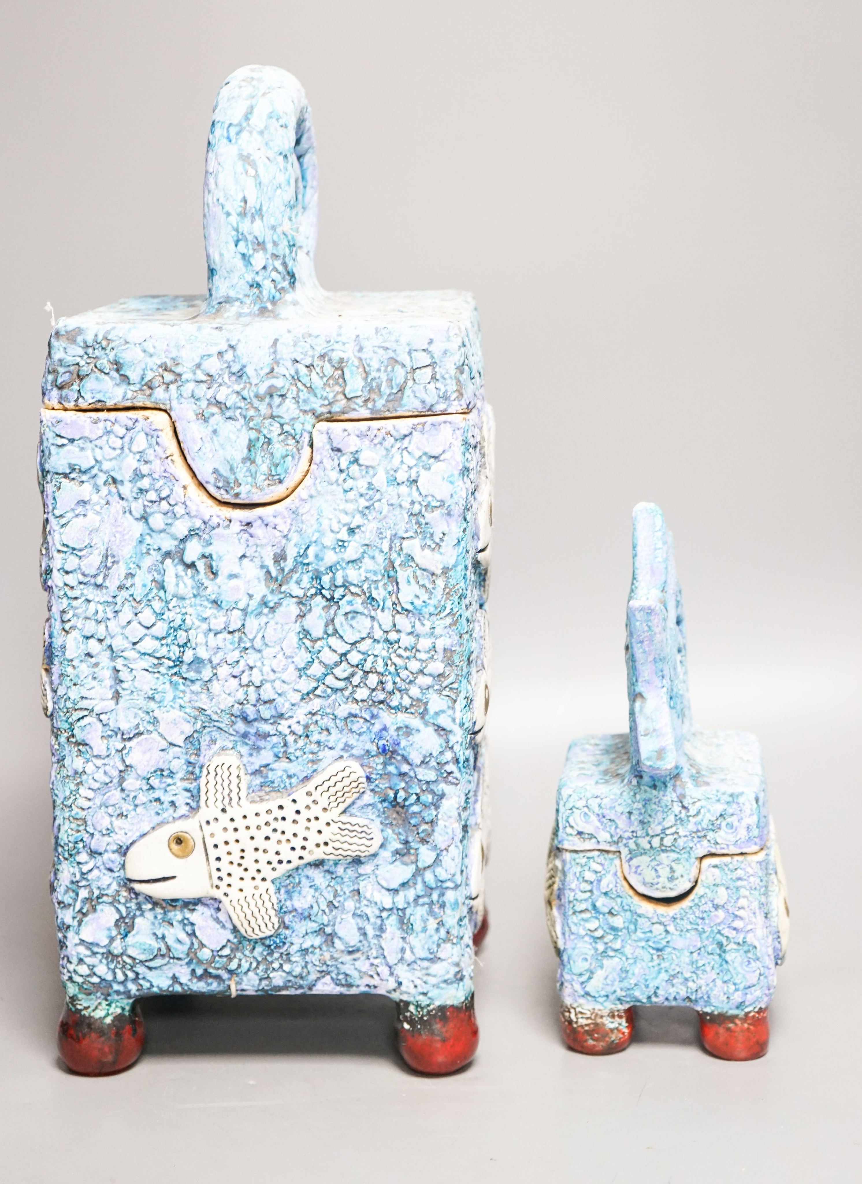 Gio Martin, a large square 'fish' jar and cover and a similar smaller jar and cover 44cm